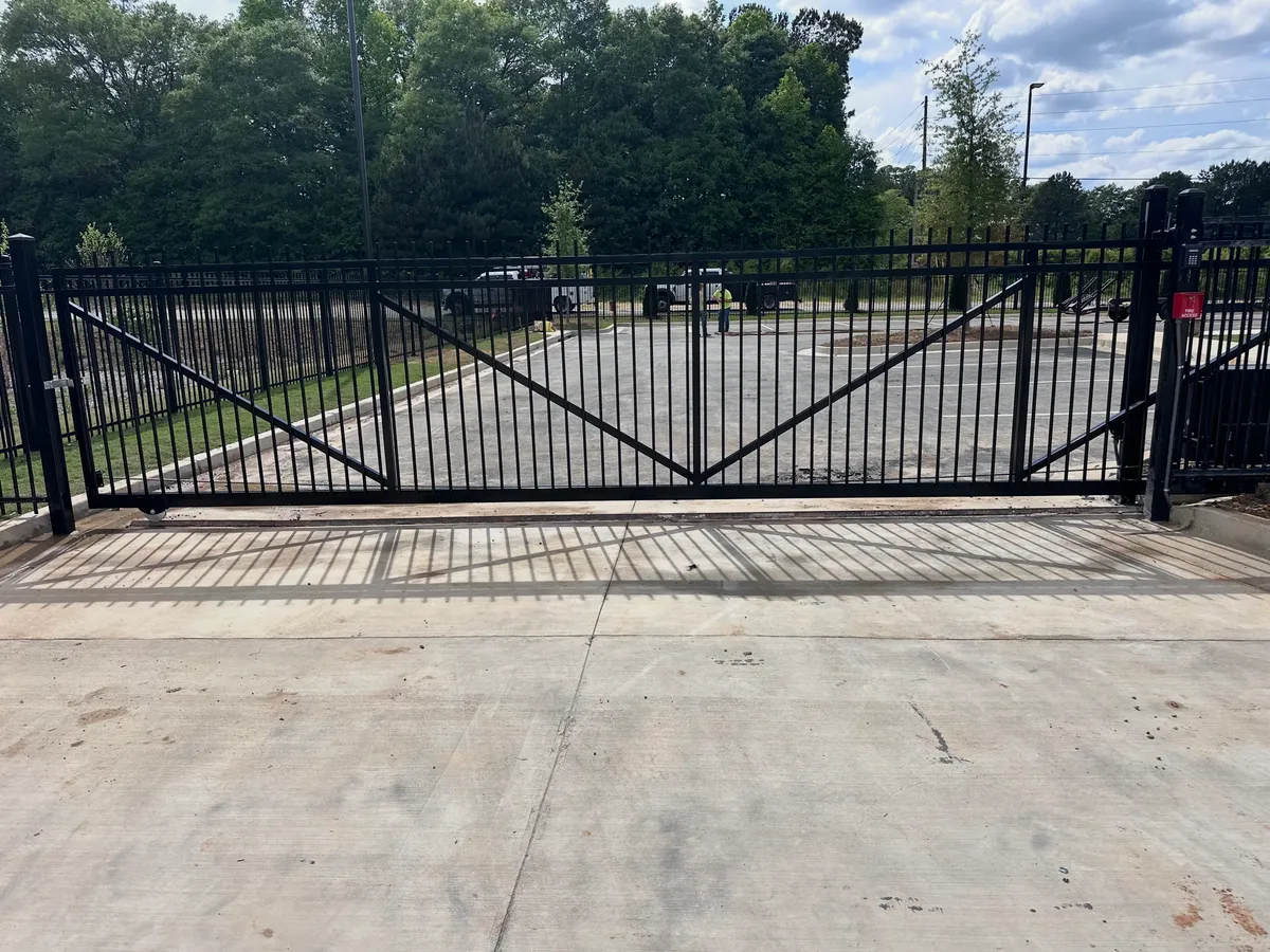 Custom rolling metal gate on V-track for Fulton County fire station in Fairburn, Georgia