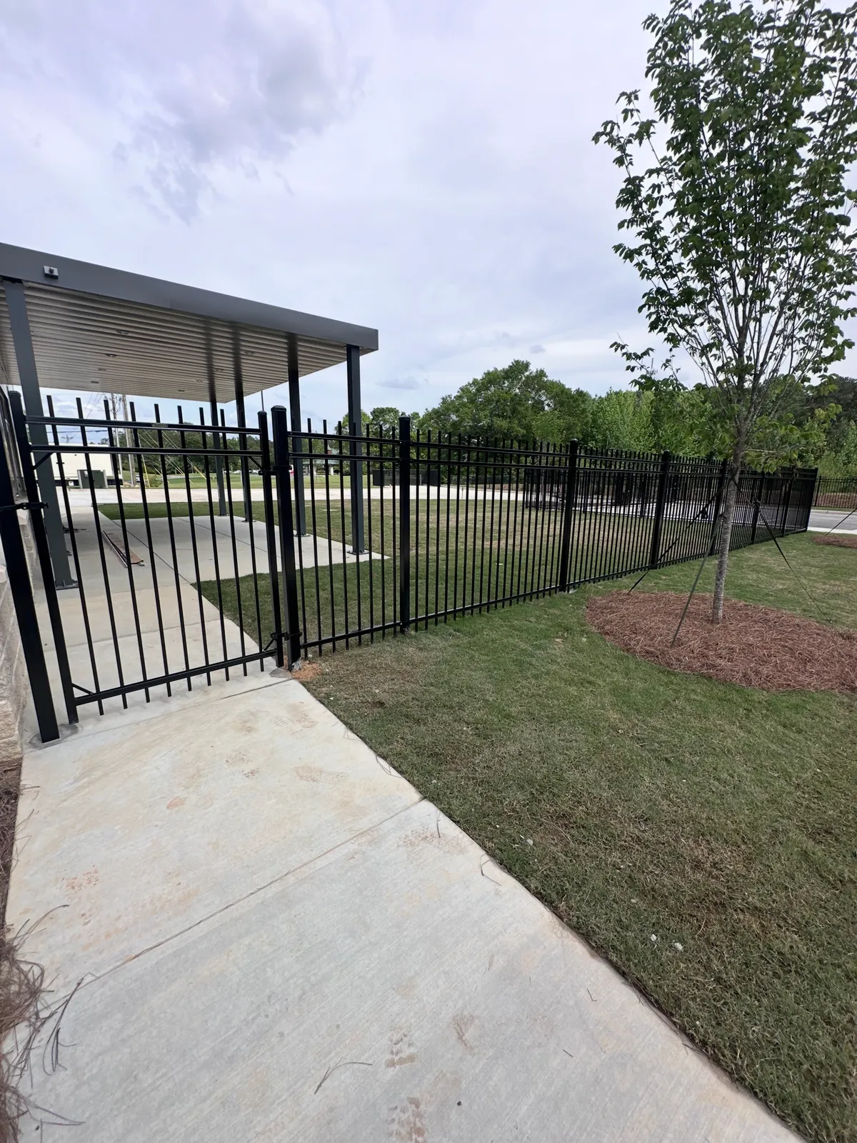 Full perimeter security enclosure around municipal fire station vehicles in Fulton County GA
