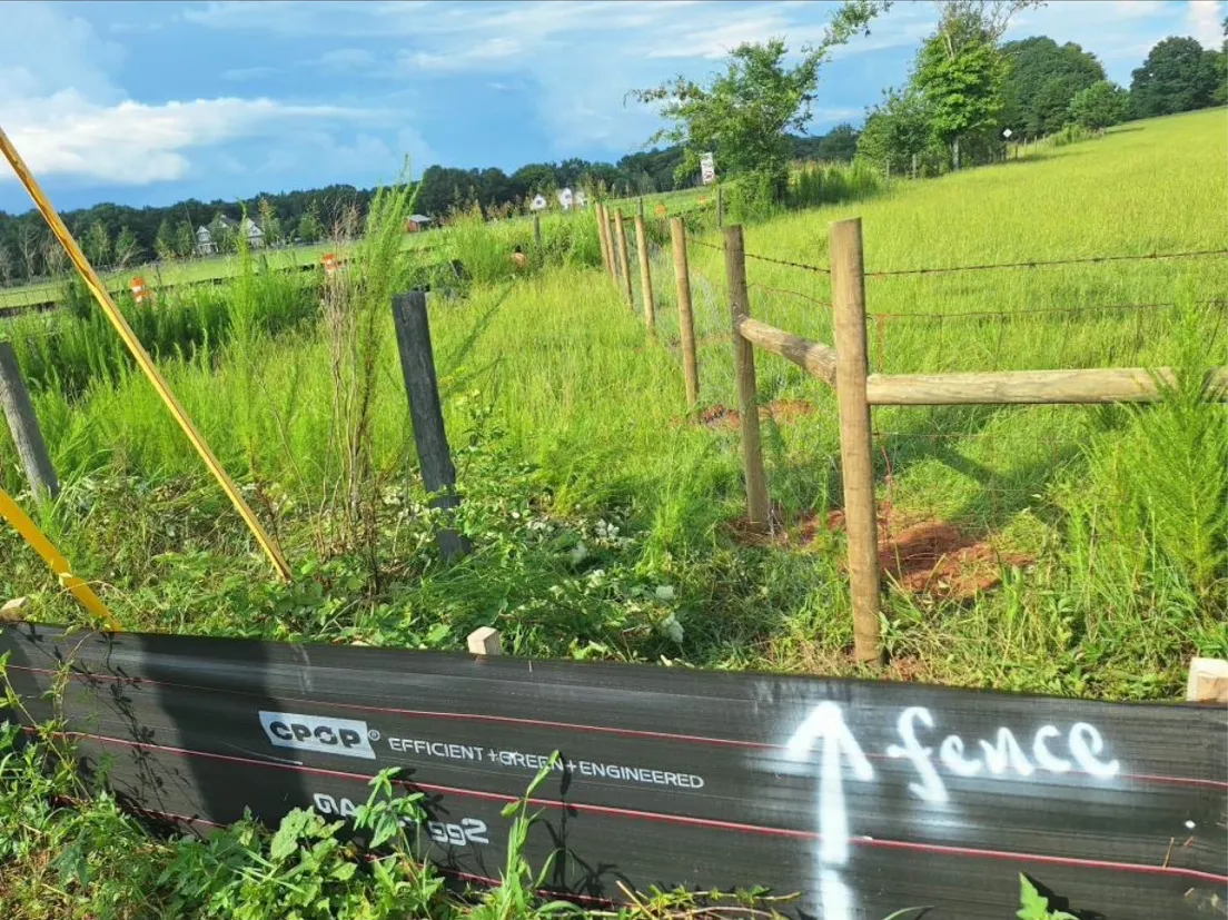 Commercial wire and post farm fence constructed for GDOT right-of-way in Watkinsville GA