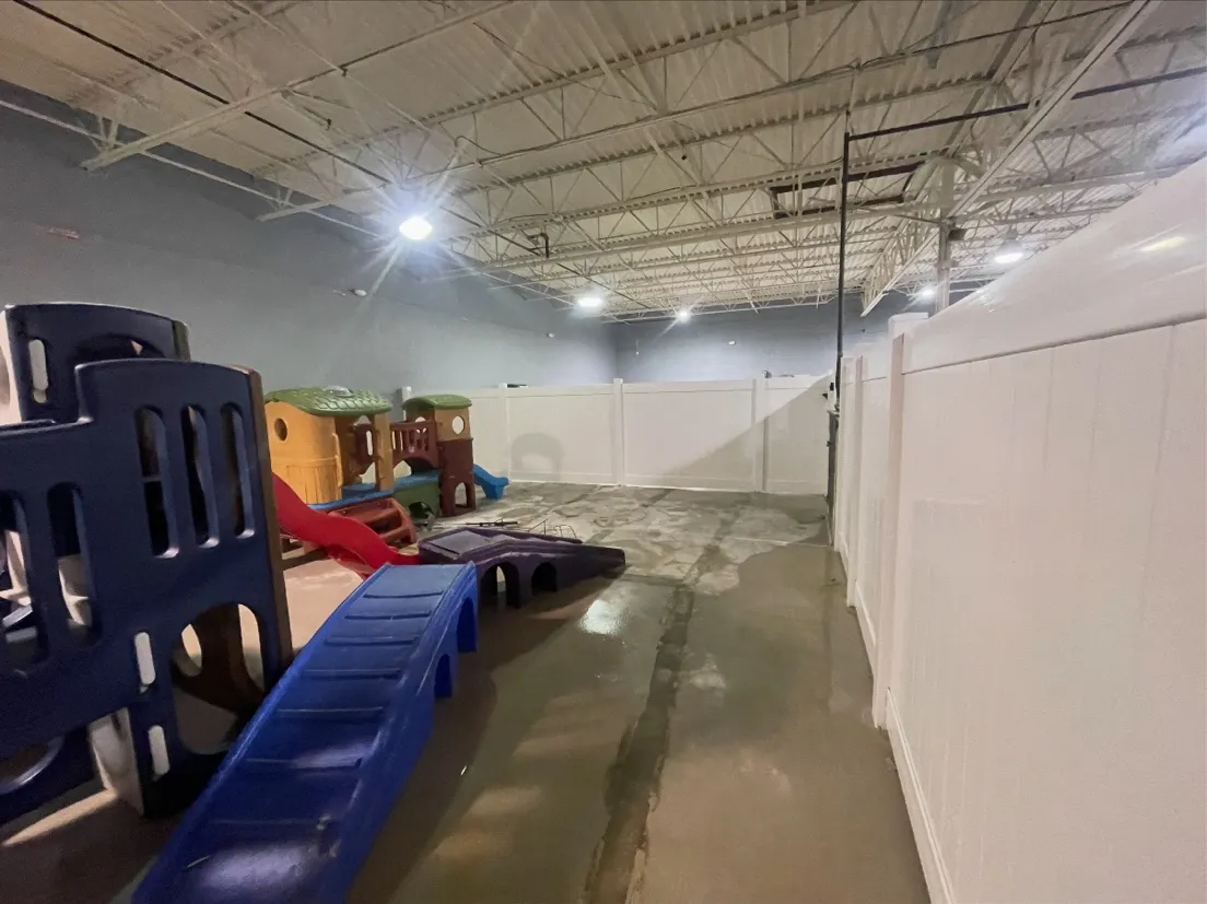 Heavy-duty pet containment fence suites at commercial canine care facility in Johns Creek