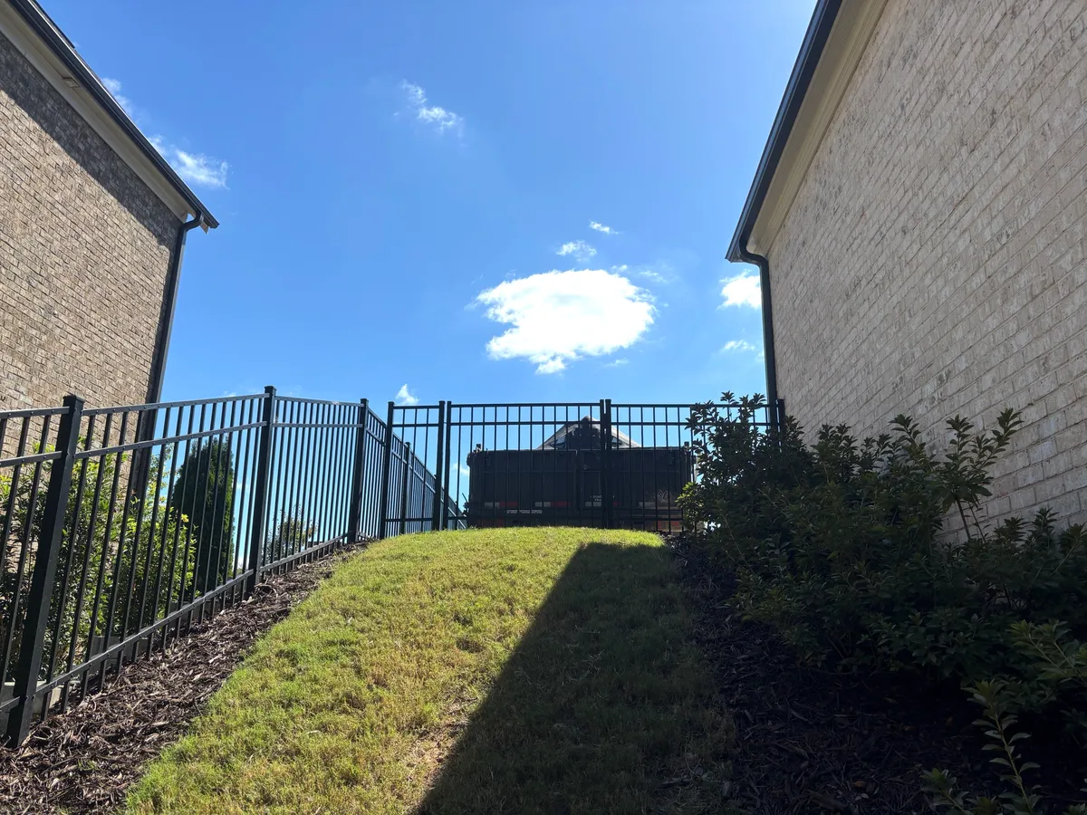 Flat-top and horizontal aluminum fencing along pool deck in Roswell, Georgia